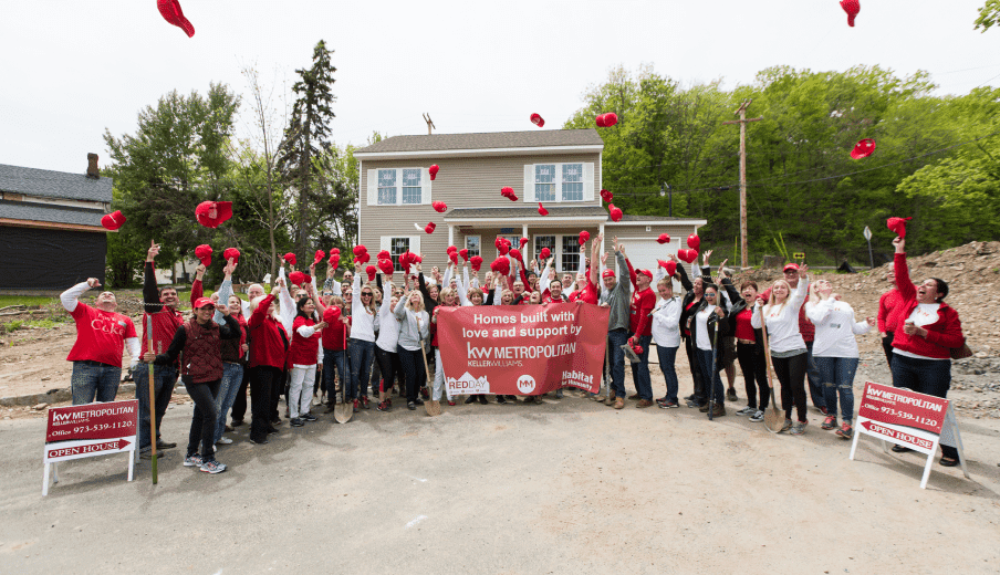 Group of agents celebrating after KW Red Day. A day of giving back to the community.