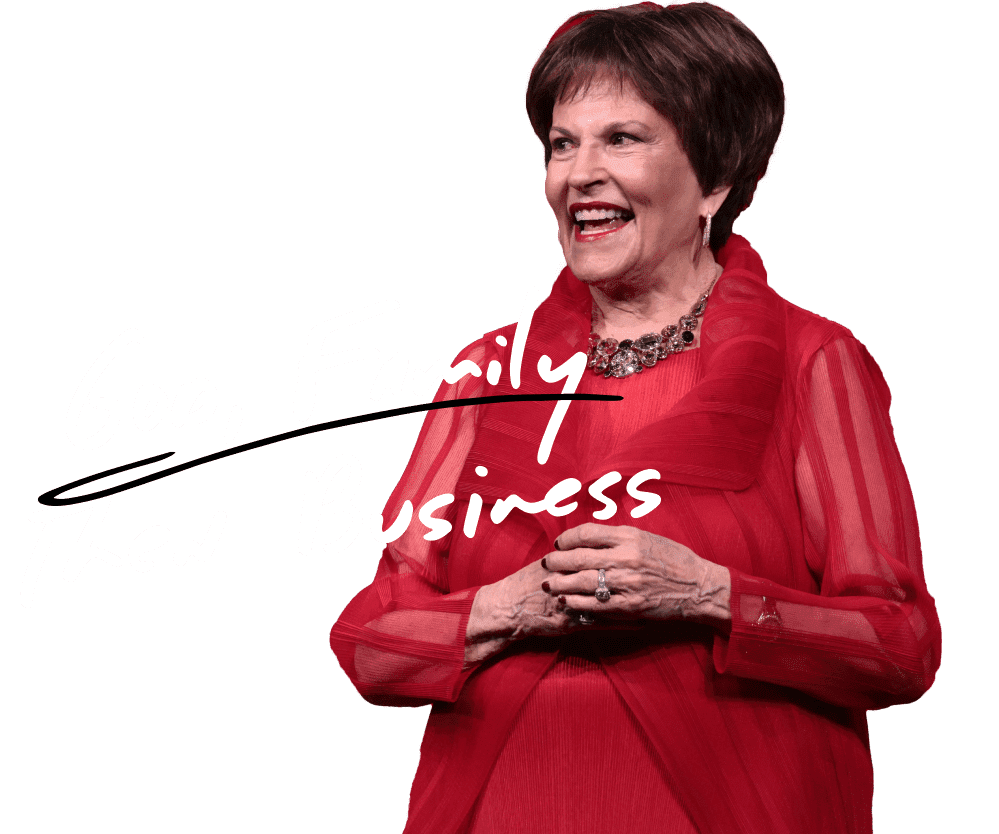 Photo of Mo Anderson smiling at a conference with the words "God, Family, and then Business" on top of her image.
