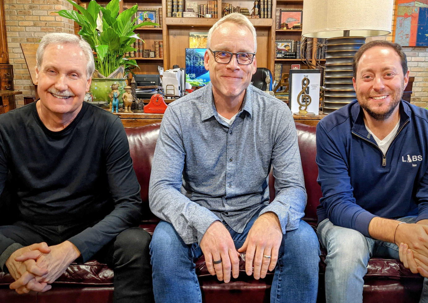 Gary Keller, Jay Papasan, and Jason Abrams sitting on a couch together. 